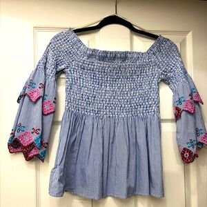 Ruched bodice off-the-shoulder top, with embroidery details.